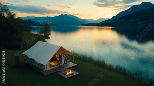 Obraz na płótnie A cozy camping scene at dusk, with a tent overlooking a tranquil mountain lake. w salonie