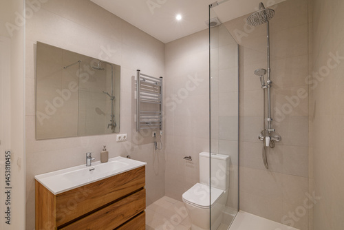 Wallpaper Mural Modern bathroom with chrome towel warmer, wood vanity and large wall mirror above sink Torontodigital.ca