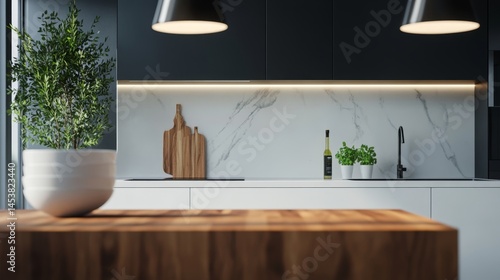 Obraz na płótnie A modern, clean kitchen interior with sleek black cabinetry and stainless steel fixtures. Featuring a marble counter, wood accents, and a potted plant for fresh air and greenery. w salonie