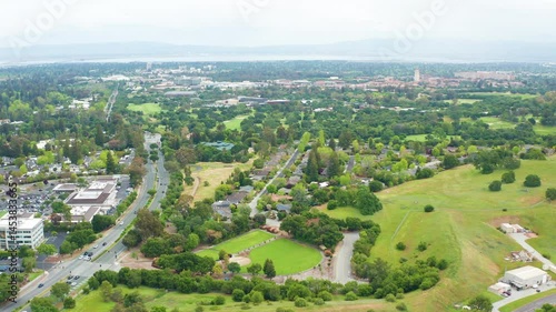 Aerial moving shot of Menlo Park Palo Alto Silicon Valley Stanford green tree