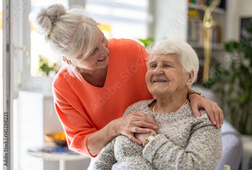 Female home caregiver providing emotional support to an elderly woman
