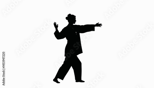 Woman practicing tai chi gracefully in silhouette, mindfulness concept