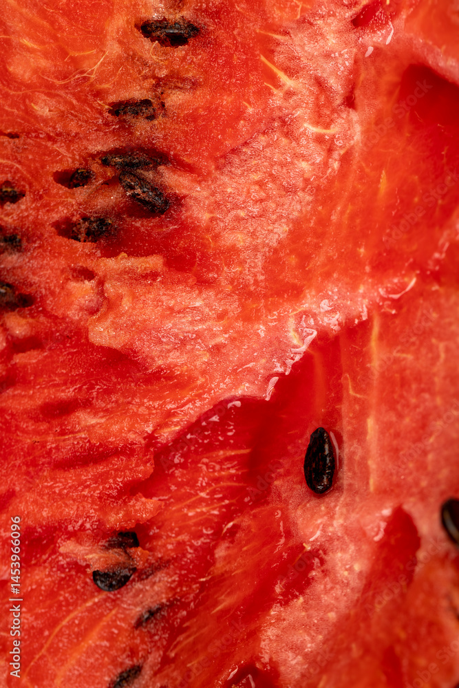 watermelon pulp with black seeds, sweet ripe watermelon cut into halves