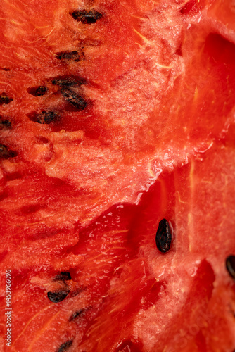 Obraz na płótnie watermelon pulp with black seeds, sweet ripe watermelon cut into halves w salonie