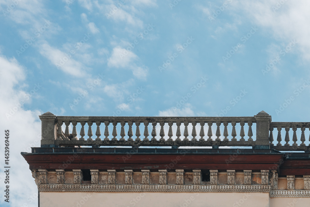 Ornamental Stone Balustrade on Historical Building Against Blue Sky Ornamental Stone Balustrade on Historical Building Against Blue Sky
