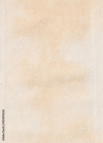 Close-up of a textured, aged beige paper surface.