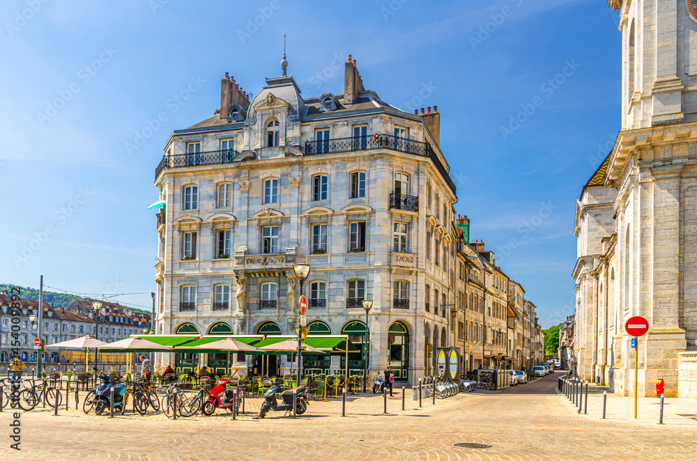 Street restaurant old building in Besancon old town centre ville, Besançon city historic centre Battant district with medieval buildings in sunny summer day, Bourgogne-Franche-Comte region, France