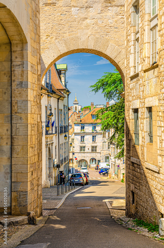 Porte Noire Black Gate Roman triumphal arch in Besancon old town centre ville, La boucle de Besançon city historic centre with medieval buildings in summer day, Bourgogne-Franche-Comte region, France