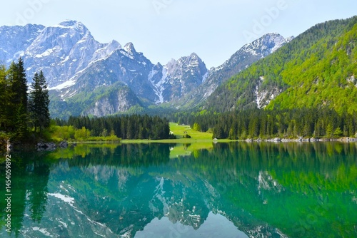 Obraz na płótnie View of lago di fusine superiore lake bellow mountain peaks in Julian alps in Italy w salonie