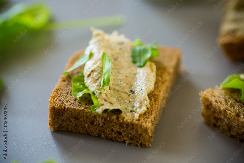 Homemade snack of rye bread with arugula and salad Homemade snack of rye bread with arugula and salad