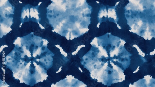 Abstract blue and white tie-dye pattern with symmetrical design in textured fabric