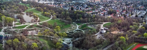 Panoramic View of Westpark and part of Munich city from above. Aerial drone shot. Trees and bushes are still partially leafless. Spring has arrived.