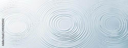 Top view of water ripples on light blue background with abstract texture and circular patterns, soft focus and copy space