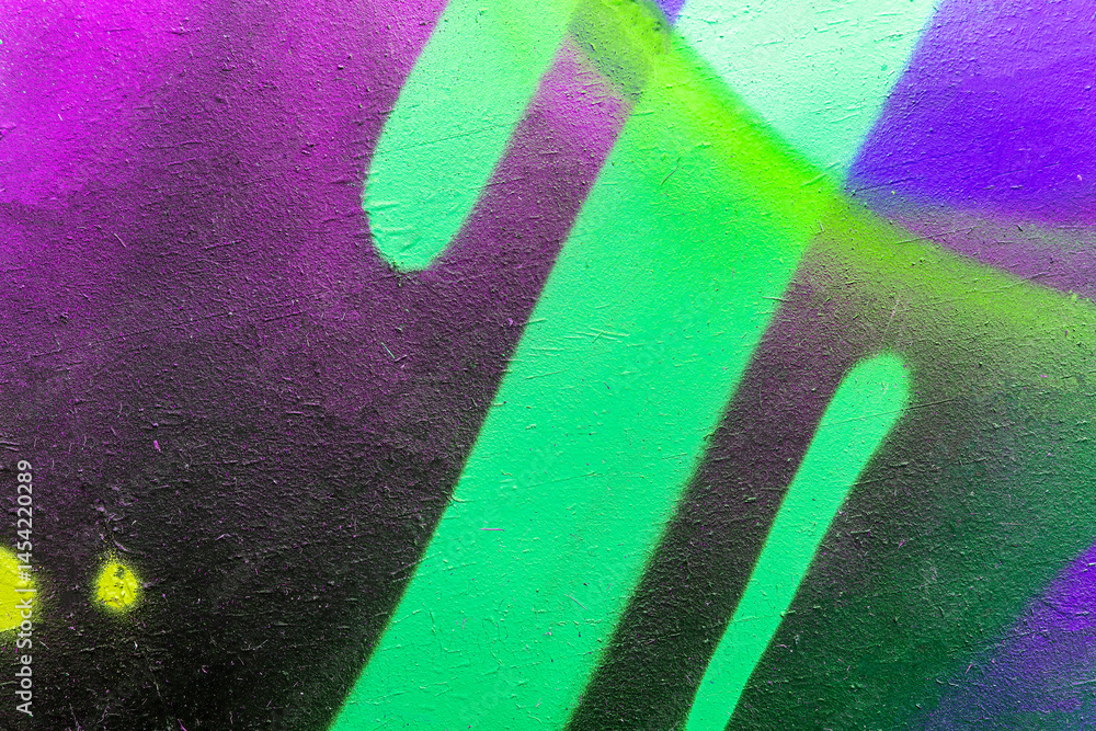 Naklejka premium Beautiful brick wall colorful street art graffiti background. Abstract creative spray drawing fashion colors painting on the walls of the city. Urban Culture, aerosol texture