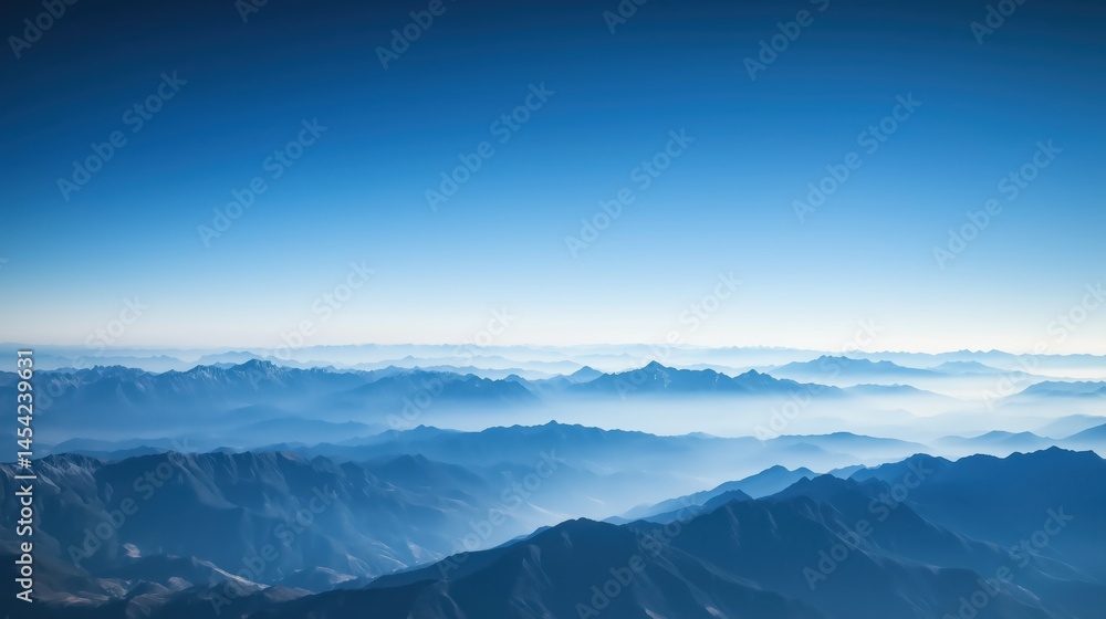 Obraz premium Vast Mountain Range Under a Clear Blue Sky