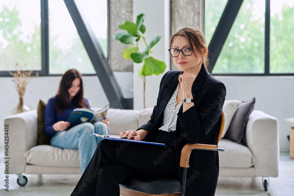 Portrait of female journalist, employer, interviewer in office