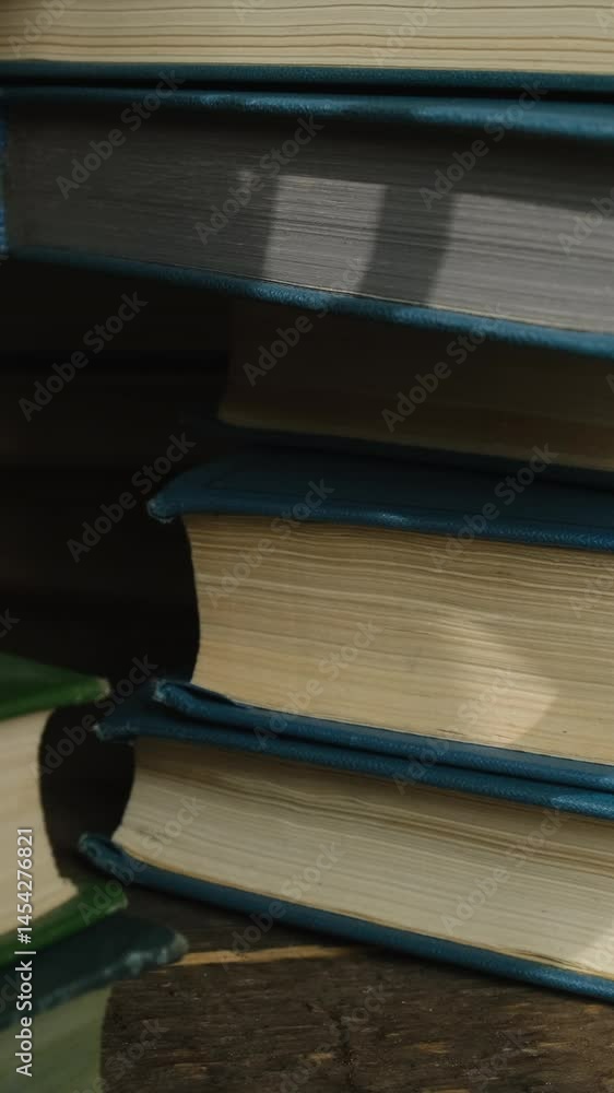 Vertical video. Education background. Bunch of old books. 