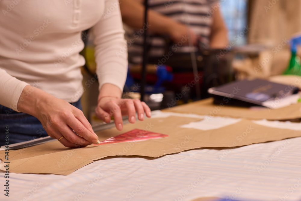 Tailoring Craftsmanship A Fashion Designer at Work Creating Beautiful Patterns with Precision