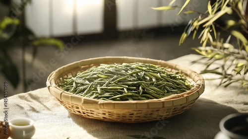 Fragrant longjing tea leaves in a woven basket, a gentle moment of peace