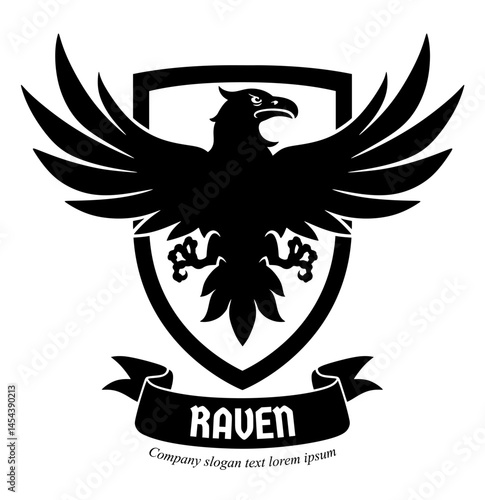Vector black raven emblem with spread wings. There are a shield behind the raven and ribbon with lettering under it.