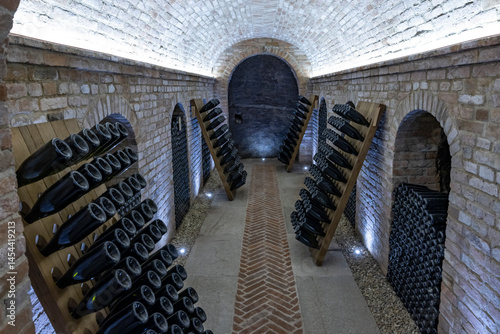 Quadro su tela Stored wine bottles, wine cella, Canale, Piedmont, Italy