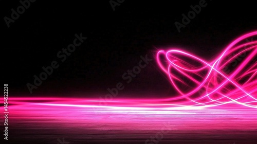 Abstract pink light trails on a dark background.