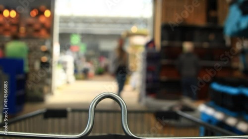 Wallpaper Mural A trolly moving in a indoor market with blurry customers shopping in it Torontodigital.ca