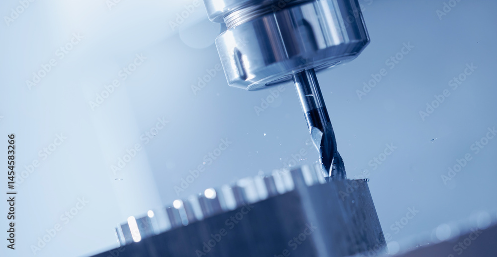 Modern CNC milling machine during operation, blue toning. Produced cutting metal parts, industry heavy factory