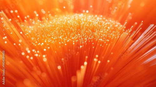 Close-up of illuminated orange fiber optic cables.