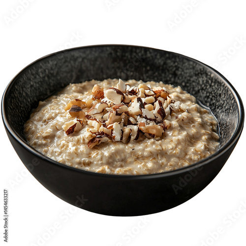 Creamy oatmeal topped with assorted nuts, served in a stylish black bowl isolated on white background and transparent background