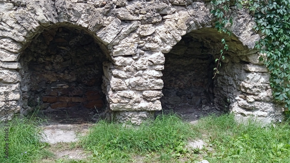 Ancient Stone Arches with Lush Greenery Surrounding Them and Copy Space
Ancient Stone Arches with Lush Greenery Surrounding Them and Copy Space