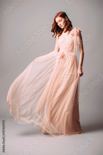 Slika na platnu Elegant bridesmaid’s two-layer maxi gown