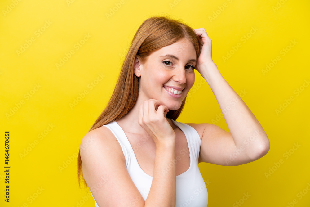 Young redhead woman isolated on yellow background . Portrait Young redhead woman isolated on yellow background . Portrait