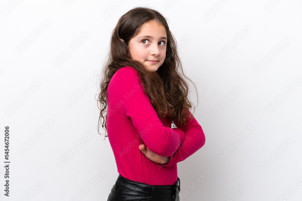 Little girl isolated on white background making doubts gesture while lifting the shoulders Little girl isolated on white background making doubts gesture while lifting the shoulders