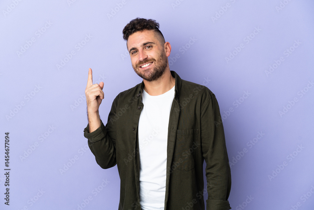 Caucasian man isolated on purple background showing and lifting a finger in sign of the best Caucasian man isolated on purple background showing and lifting a finger in sign of the best