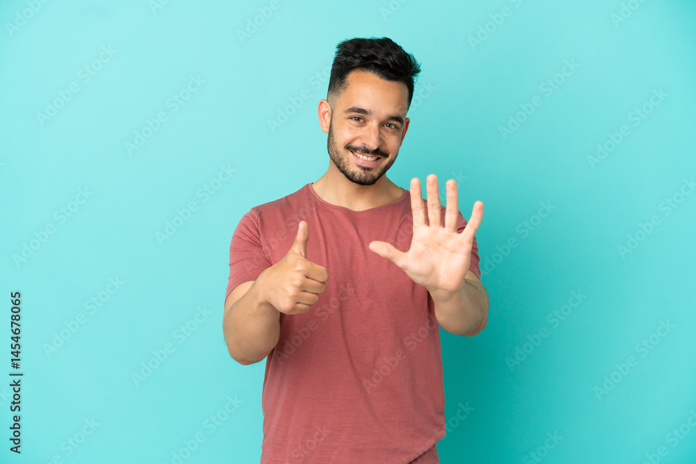 Young caucasian man isolated on blue background counting six with fingers Young caucasian man isolated on blue background counting six with fingers