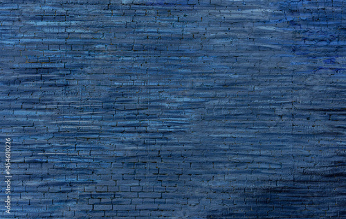 The old wall is painted blue. The wall is made of brick.