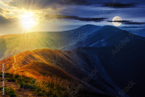 mountain landscape with sun and moon at twilight. traverse path through hill side to the mountain top. day and night time change concept. mysterious countryside scenery in morning light