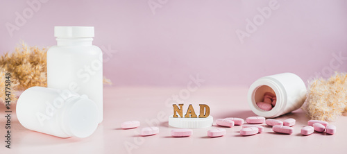 Obraz na płótnie Nicotinamide adenine dinucleotide anti-aging pills and bottles on the table web banner w salonie