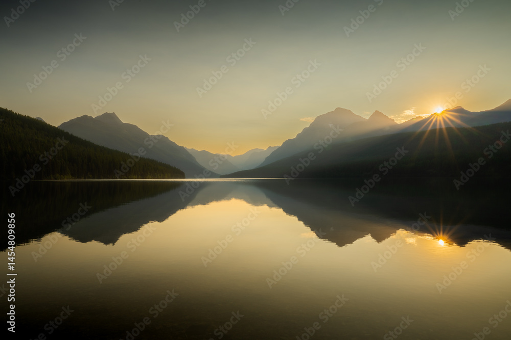 Warm Sunburst Starts The Day Over Bowman Lake In Glacier