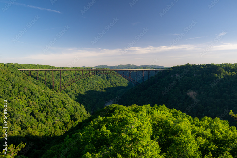 Whisps Of Clouds Float Below New River Gorge Bridge In West Virginia