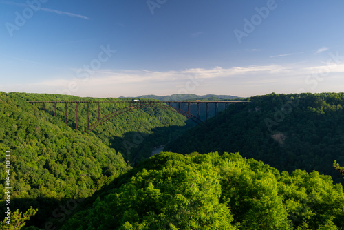 Whisps Of Clouds Float Below New River Gorge Bridge In West Virginia