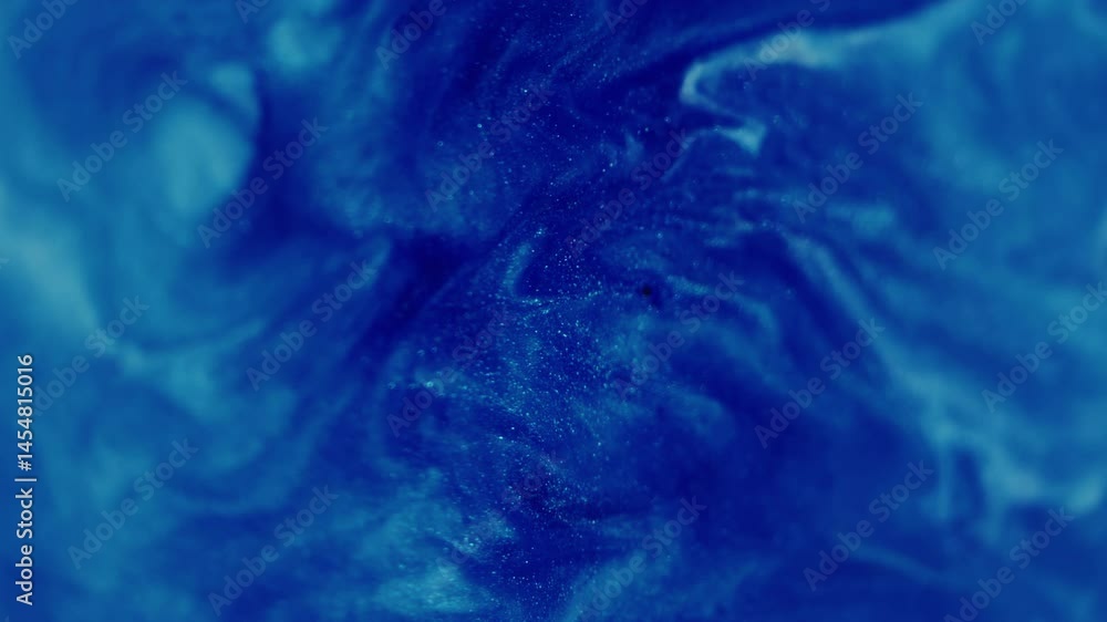 Oil fluid flow. Blur glitter texture. Blue white color sparkling shimmering particles paint drop wave falling on abstract art background. Oil fluid flow. Blur glitter texture. Blue white color sparkling shimmering particles paint drop wave falling on abstract art background.