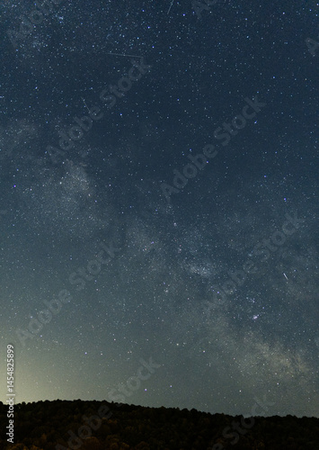 Obraz na płótnie Stunning view of the Milky Way galaxy and countless stars in the night sky. Long exposure astrophotography capturing the beauty of deep space w salonie