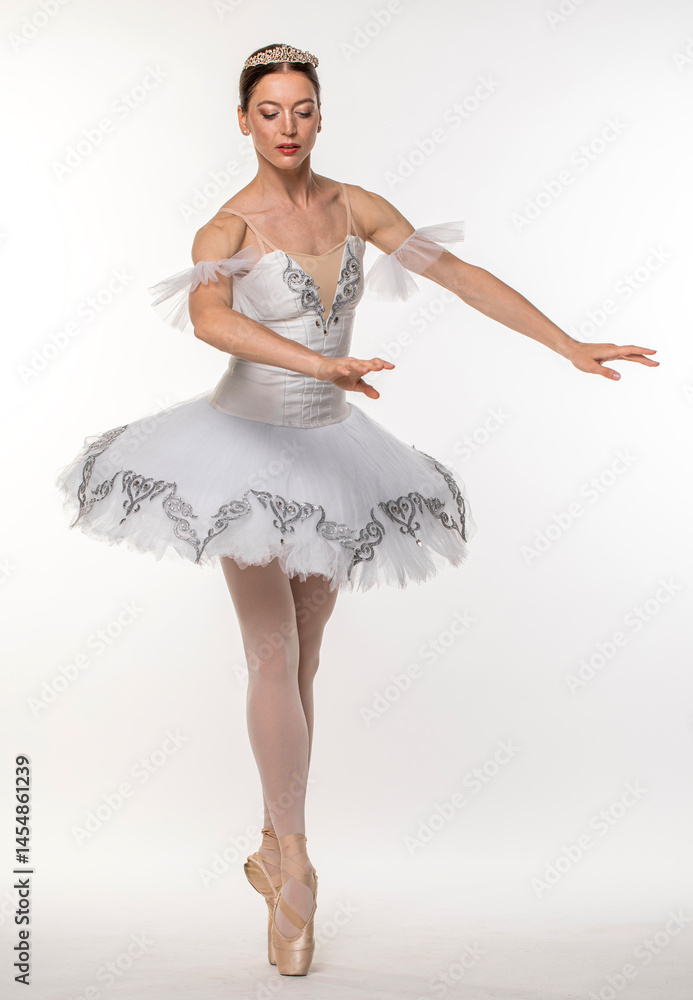 Naklejka premium Studio portrait of a ballerina in a white tutu
