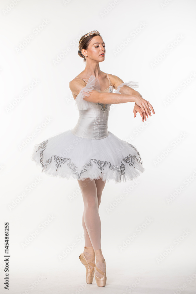 Naklejka premium Studio portrait of a ballerina in a white tutu