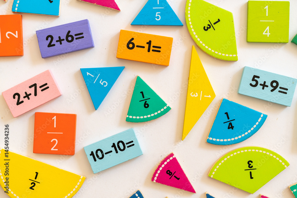 Colorful educational math manipulatives displayed on a white surface for engaging learning activities in a classroom setting Colorful educational math manipulatives displayed on a white surface for engaging learning activities in a classroom setting