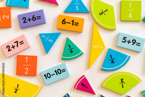 Colorful educational math manipulatives displayed on a white surface for engaging learning activities in a classroom setting