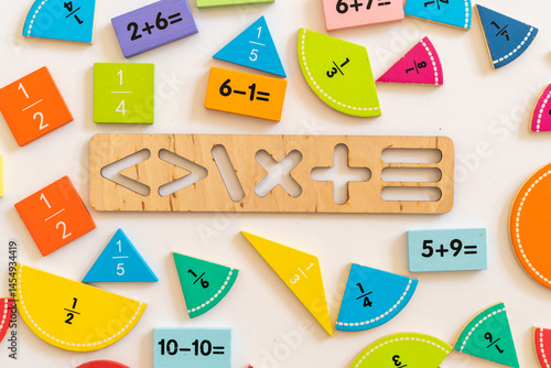 Colorful wooden math manipulatives arranged creatively on a table for educational activities in a home or classroom setting