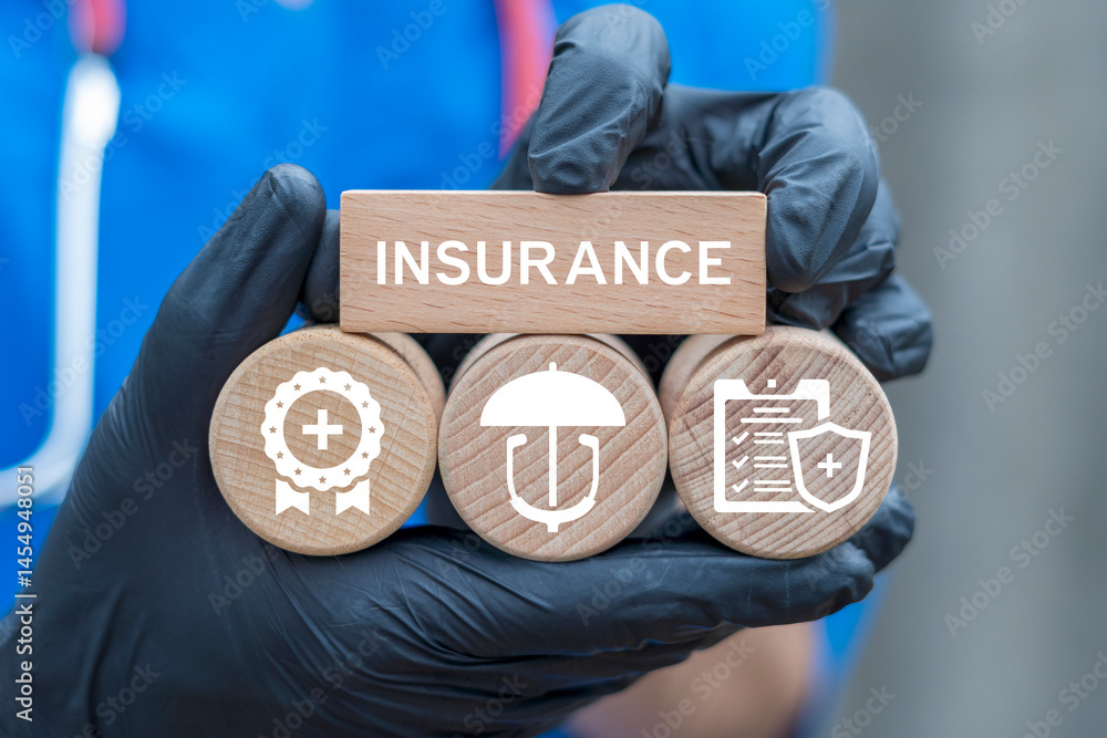 Health insurance and medical billing concept. Physician holding wooden blocks with icons sees word: HEALTH INSURANCE.